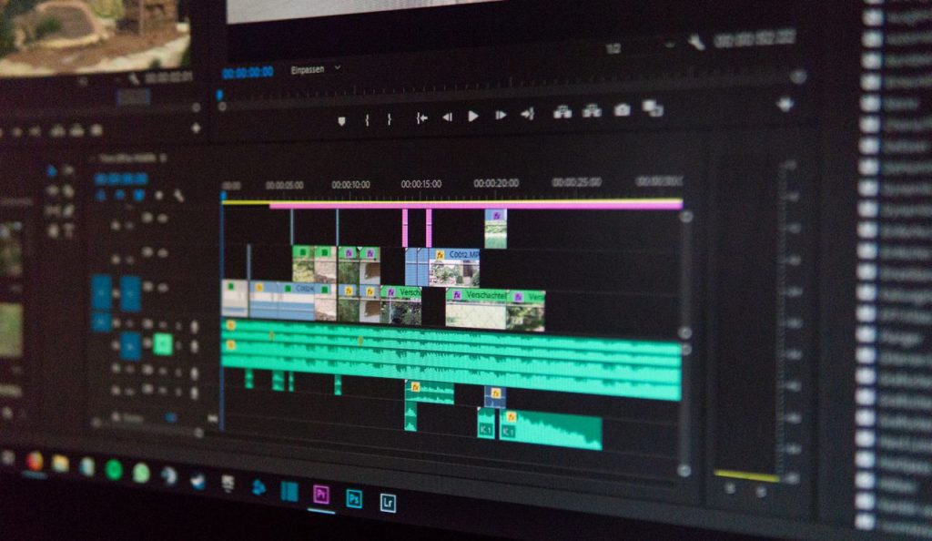 Services Close-up of a video editing timeline interface on a computer screen, showcasing professional software in action.